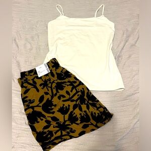 Beige and black pattern shorts with cream tank top